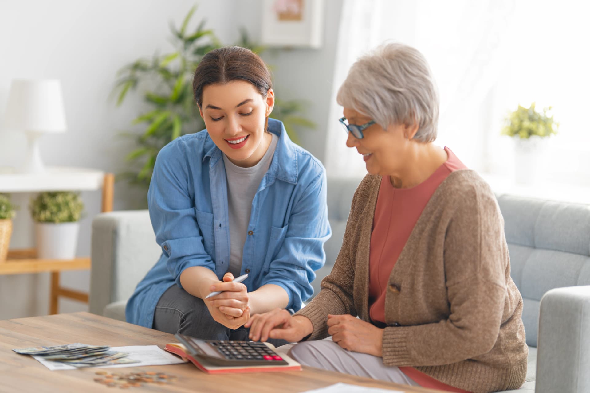 Caregiver helping senior with home finances
