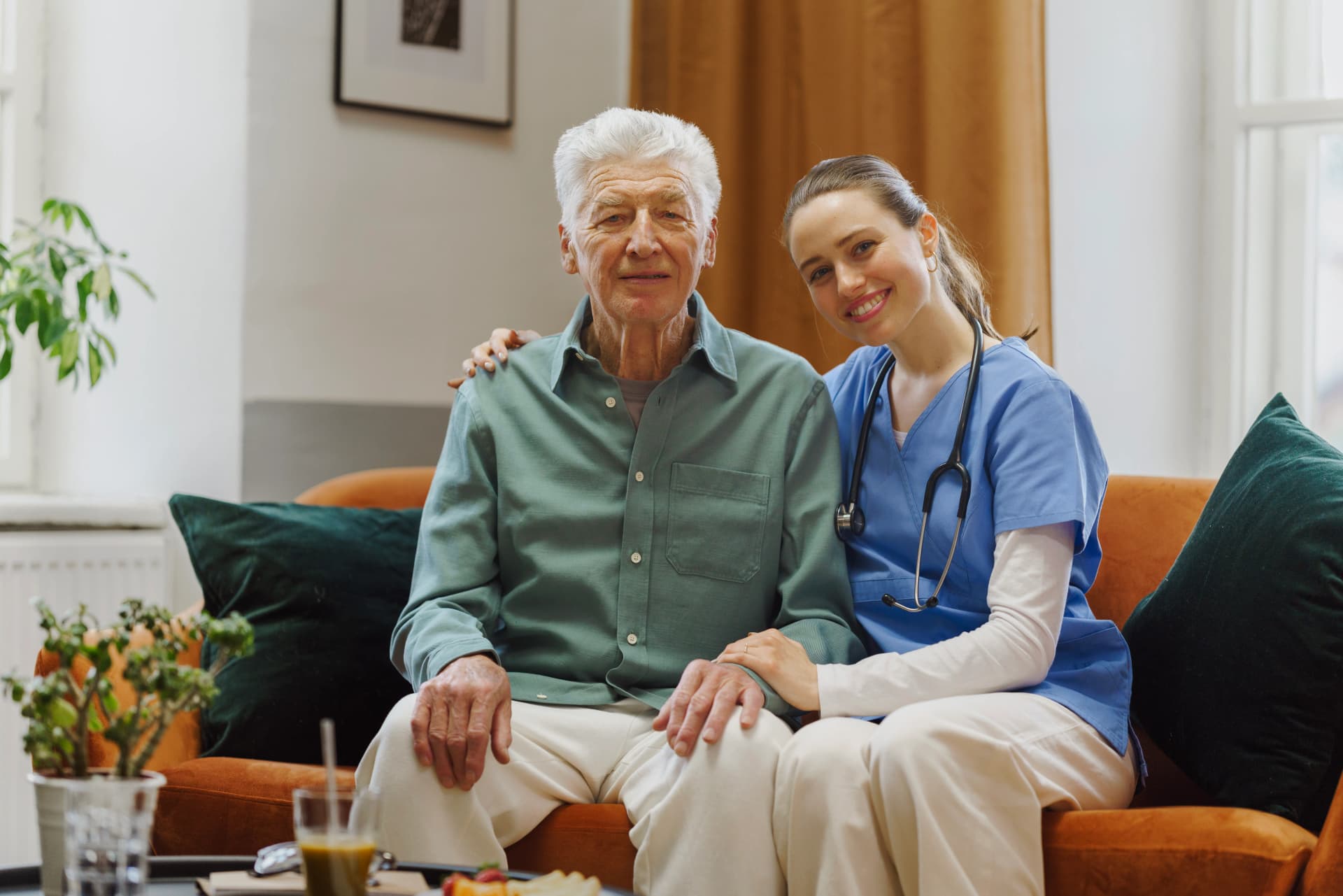 Smiling senior with caregiver